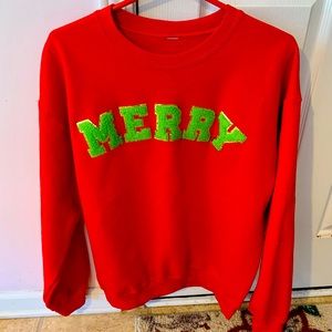 Red Christmas Sweatshirt with lime green chenille letters saying MERRY